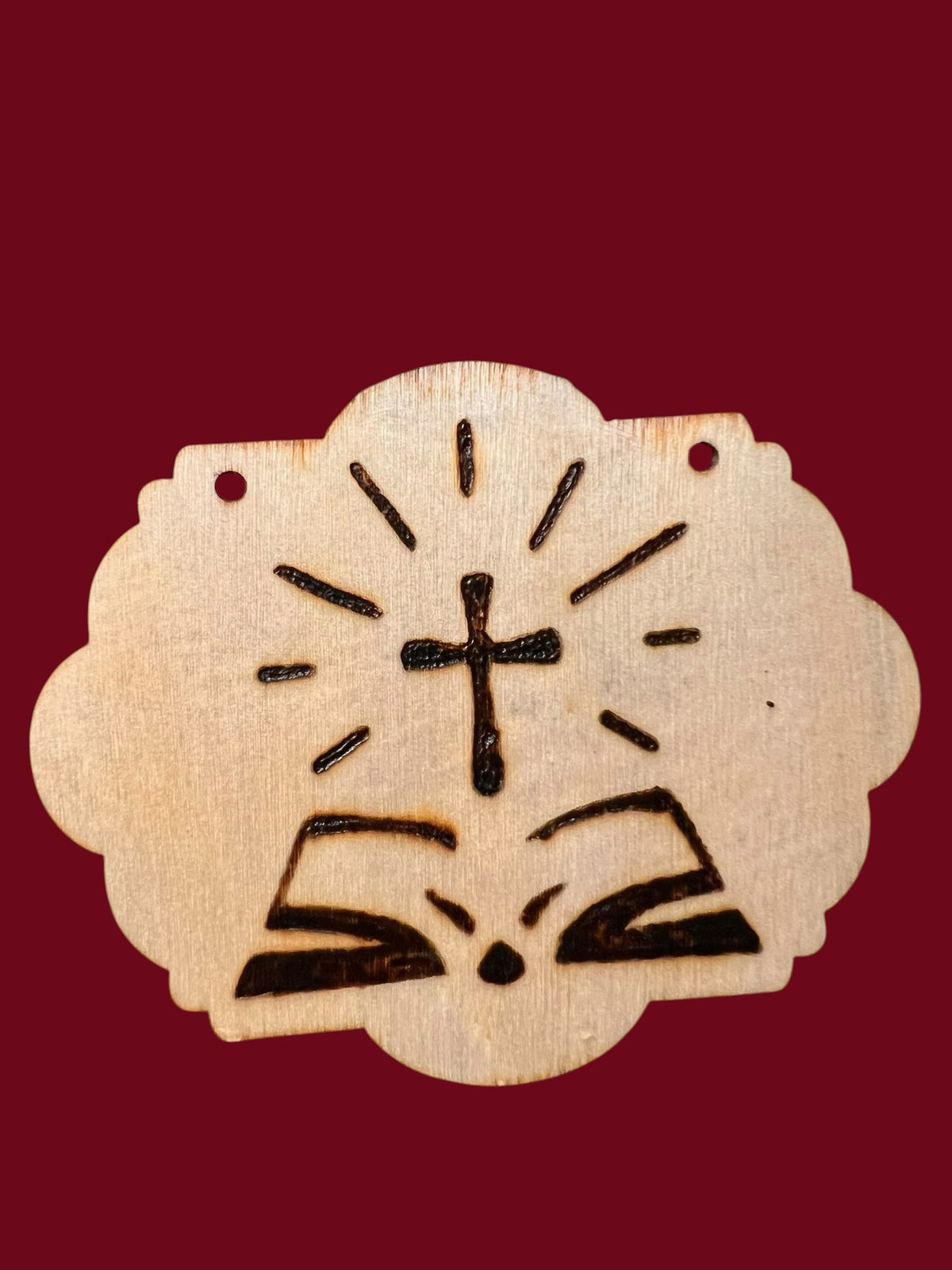 The Wooden Stuff Shop & Crafts handcrafted wooden plaque featuring a hand-burned cross above an open Bible design.