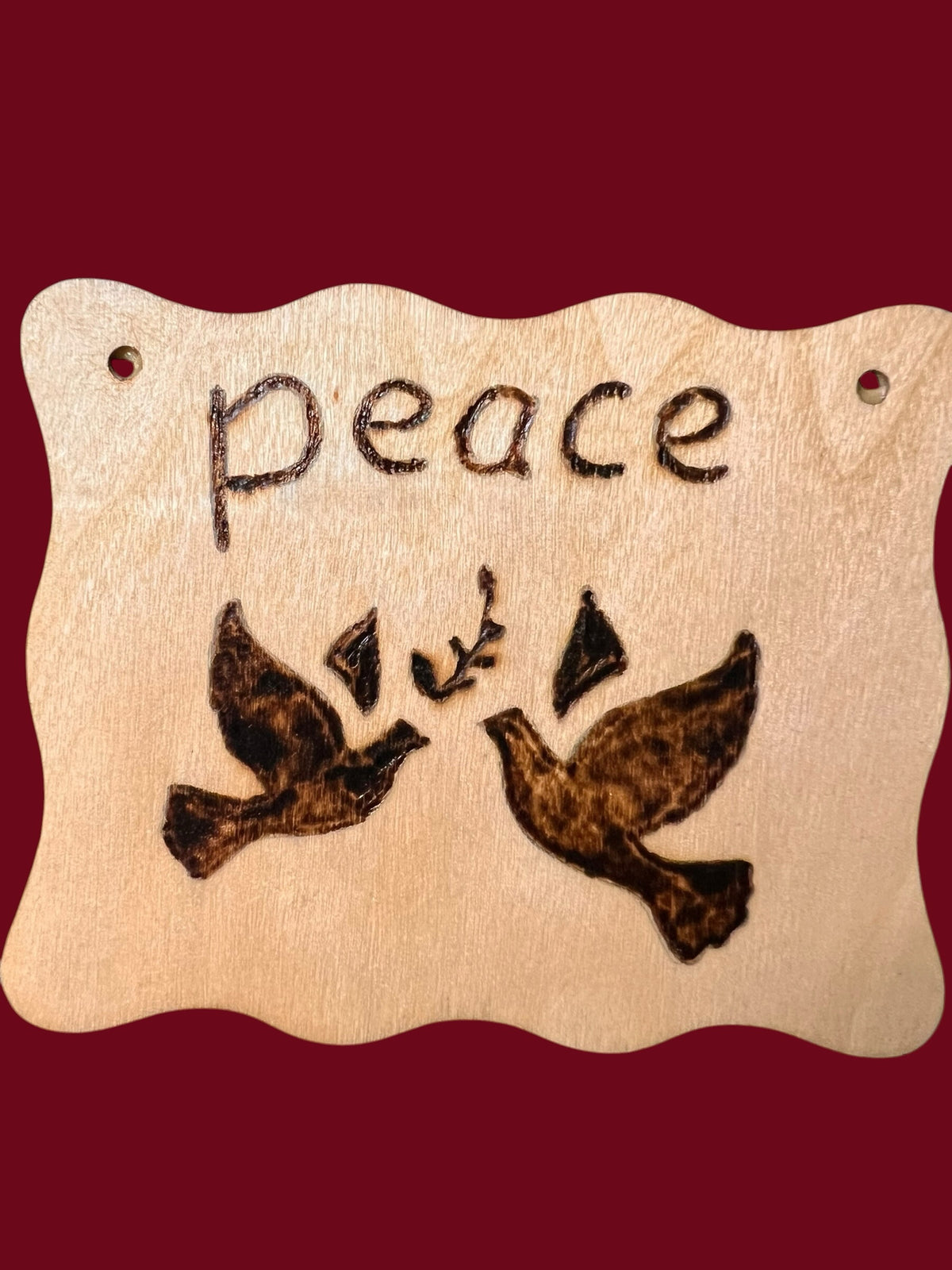 The Wooden Stuff Shop & Crafts rustic wooden wall plaque featuring a hand-burned peace sign with two doves and olive branch