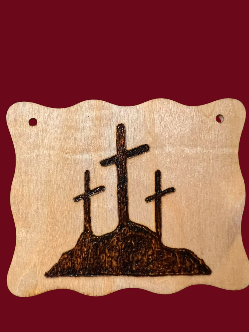 The Wooden Stuff Shop & Crafts rustic wooden plaque featuring a hand-burned design of three crosses on a hill.